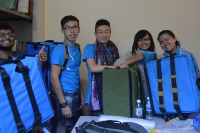 Melody (first right) and her team designed and created an innovative mobile drug dispensary box that enables staff of a Cambodian NGO to more effectively dispense medicines in the slums of Phnom Penh.